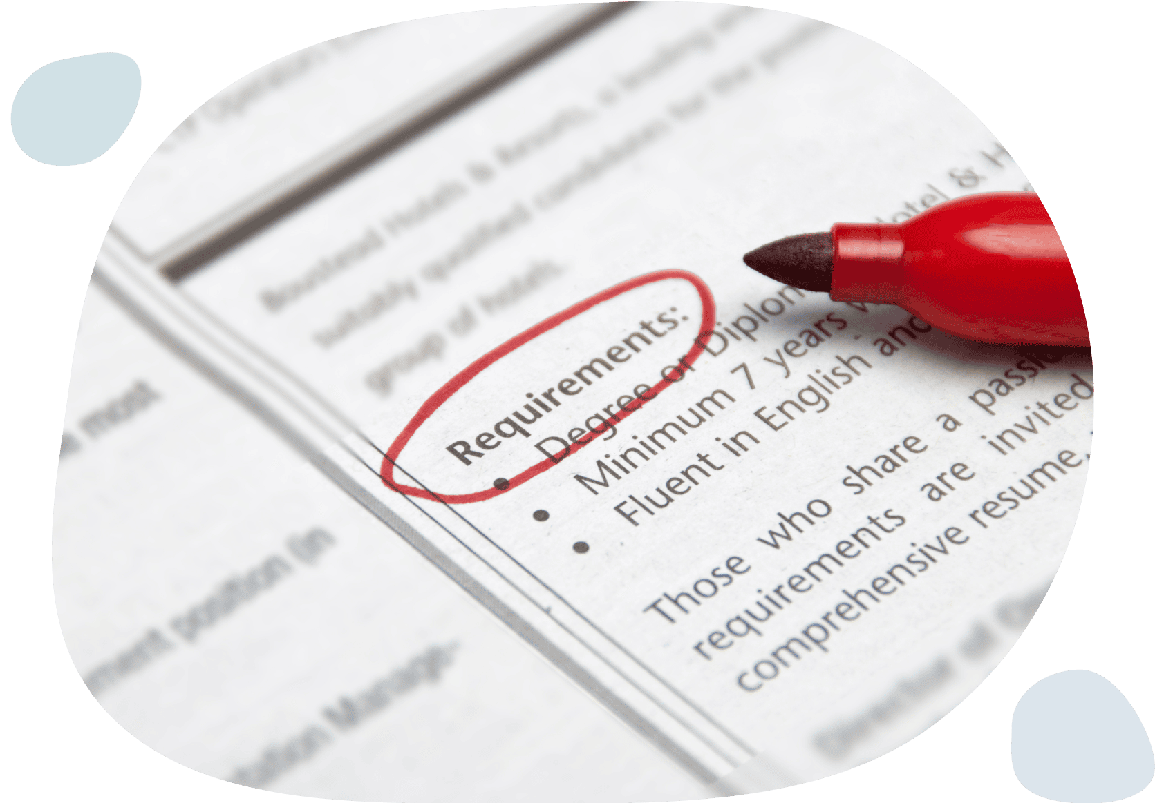 A red pen highlights a requirement on a document, emphasizing its importance.